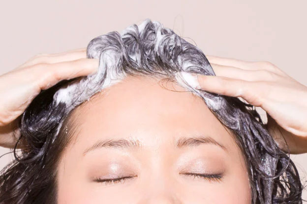 A woman washing her hair